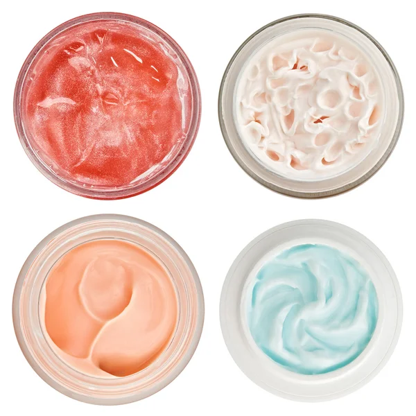 Set di 4 diverse creme dermiche e gel isolati su bianco — Foto Stock