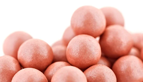 Pink cosmetics rouge balls isolated on white, super macro — Stock Photo, Image
