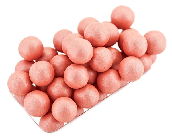 Pink cosmetics rouge balls isolated on white, macro — Stock Photo, Image