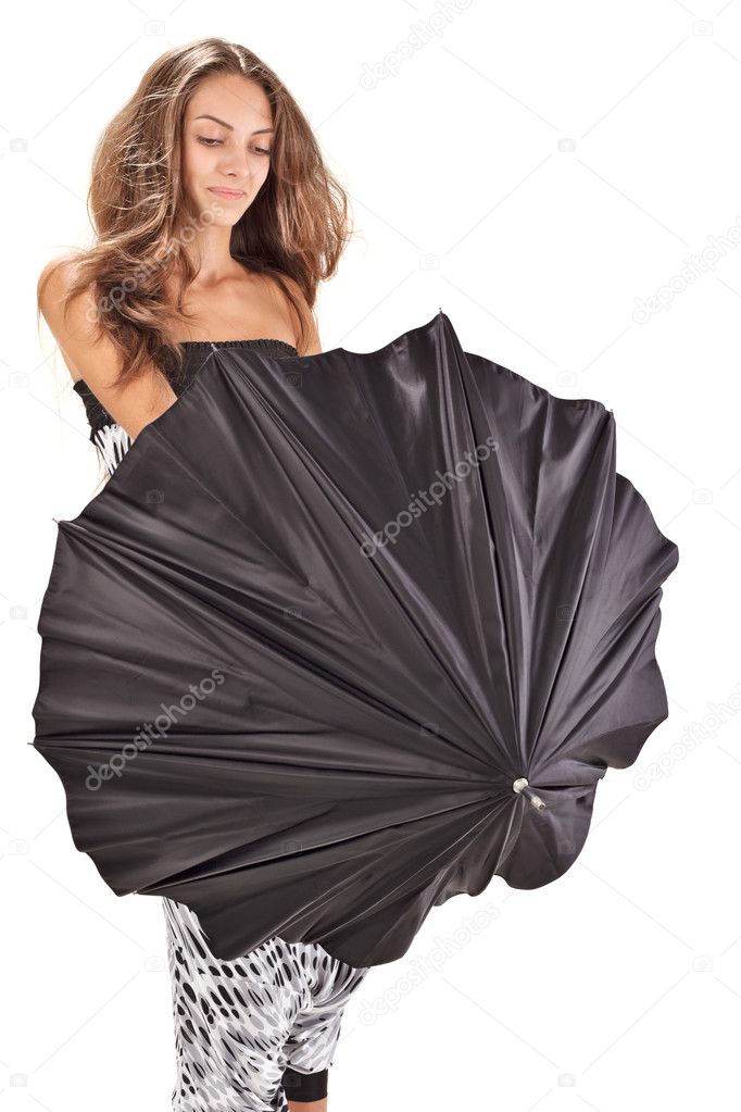 Young beautiful woman playing with black umbrella