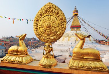 Golden brahma symbol in front of Boudha Nath (Bodhnath) stupa in clipart