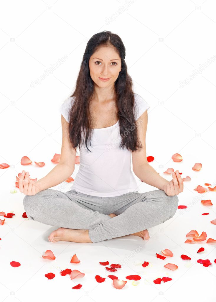 Young beautiful woman meditating in lotus pose