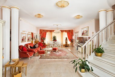 Classic style drawing-room interior in red and golden colors, view from hall clipart