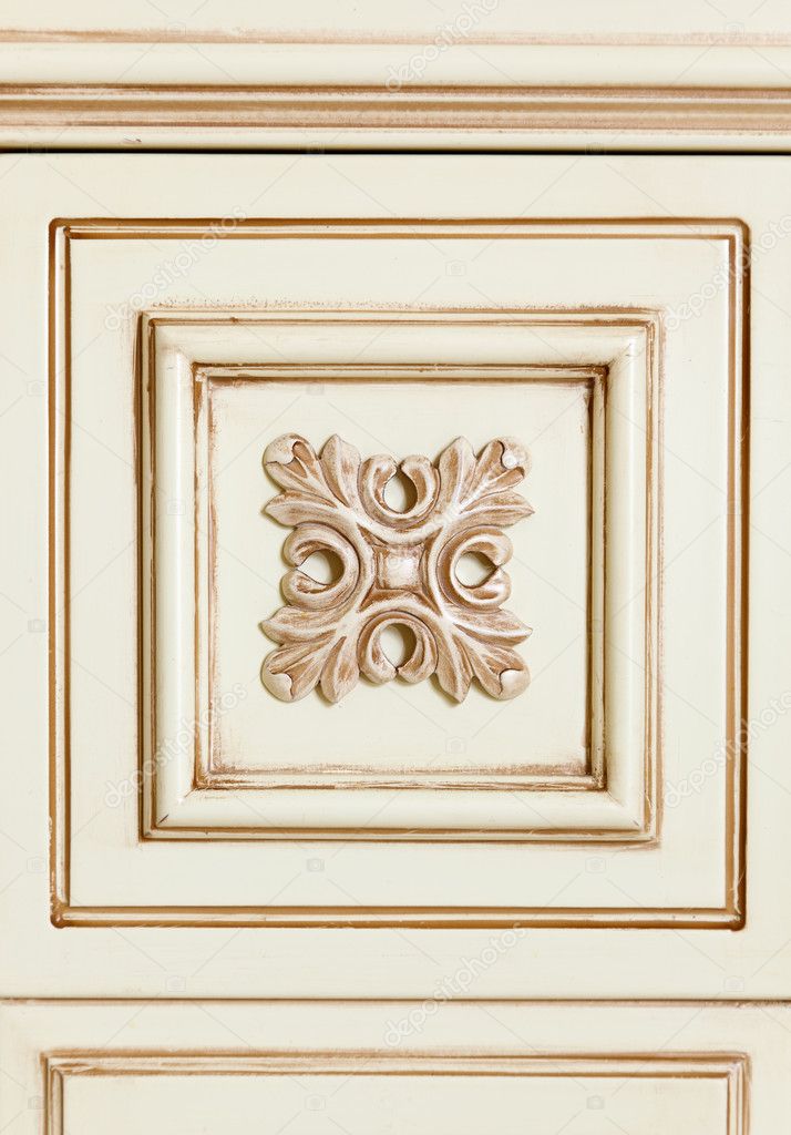 Fragment of beige wooden furniture tile with flower pattern