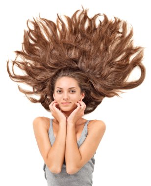 Young beautiful brunette woman with scattered long hairs clipart