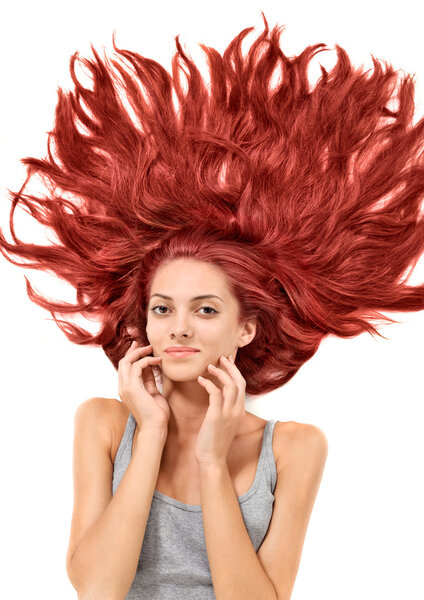 Young beautiful redhead woman with scattered long hairs