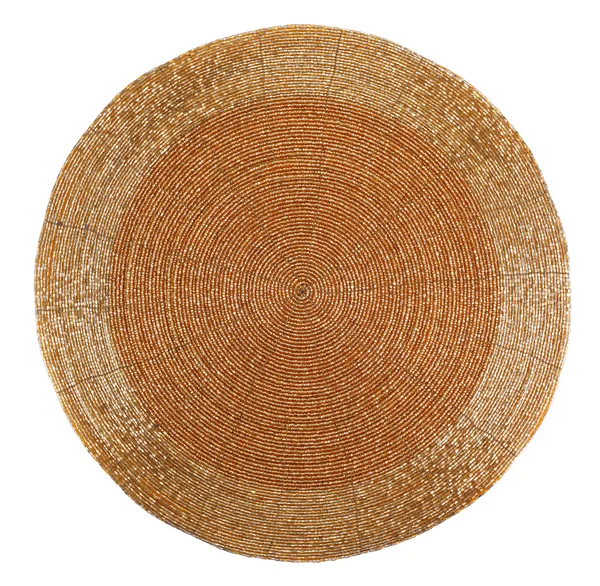 Коврик из золотого бисером стола с круглыми линиями — стоковое фото