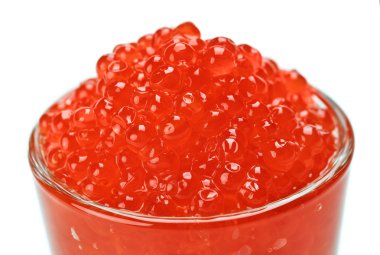 Red salmon caviar in a glass isolated on white clipart