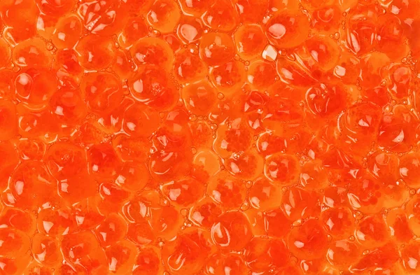 Červený losos kaviár textury pozadí — Stock fotografie