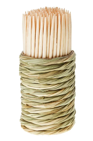 Bunch of wooden toothpick in round wattled straw holder — Stock Photo, Image