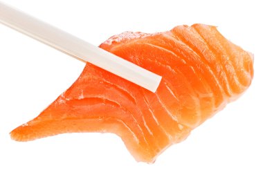 Slice of red salmon fish in chopsticks, isolated on white clipart