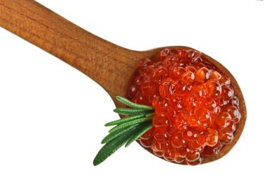 Red salmon caviar heap in wooden spoon with rosemary leaf isolated on white, macro view clipart