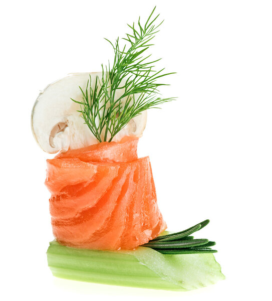 Elegant canape with salmon roll, celery, dill twig and agaric isolated on white