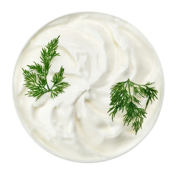 Sour cream in small round plate with dill twig — Stock Photo, Image