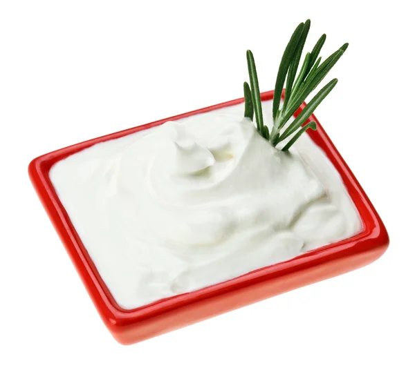 Sour cream in red small square plate with rosemary twig — Stock Photo, Image