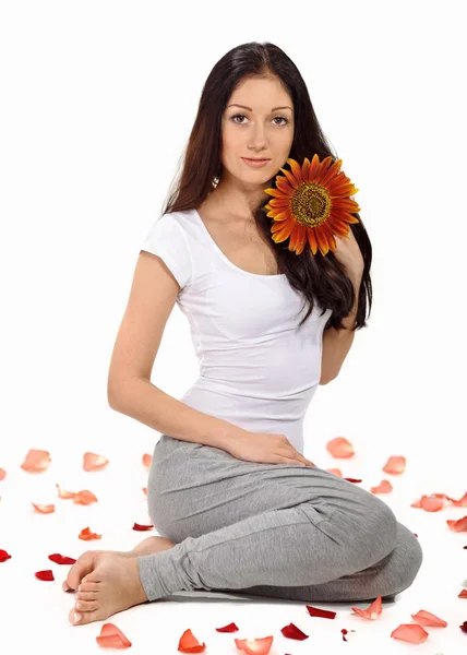 Young beautiful lady holding sunflower near face — Stock Photo, Image