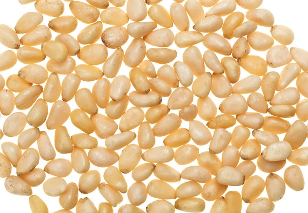 Unshelled noten van de pijnboom geïsoleerd op wit, voedsel achtergrond — Stockfoto