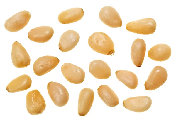 Unshelled pine nuts isolated on white, food background — Stock Photo, Image