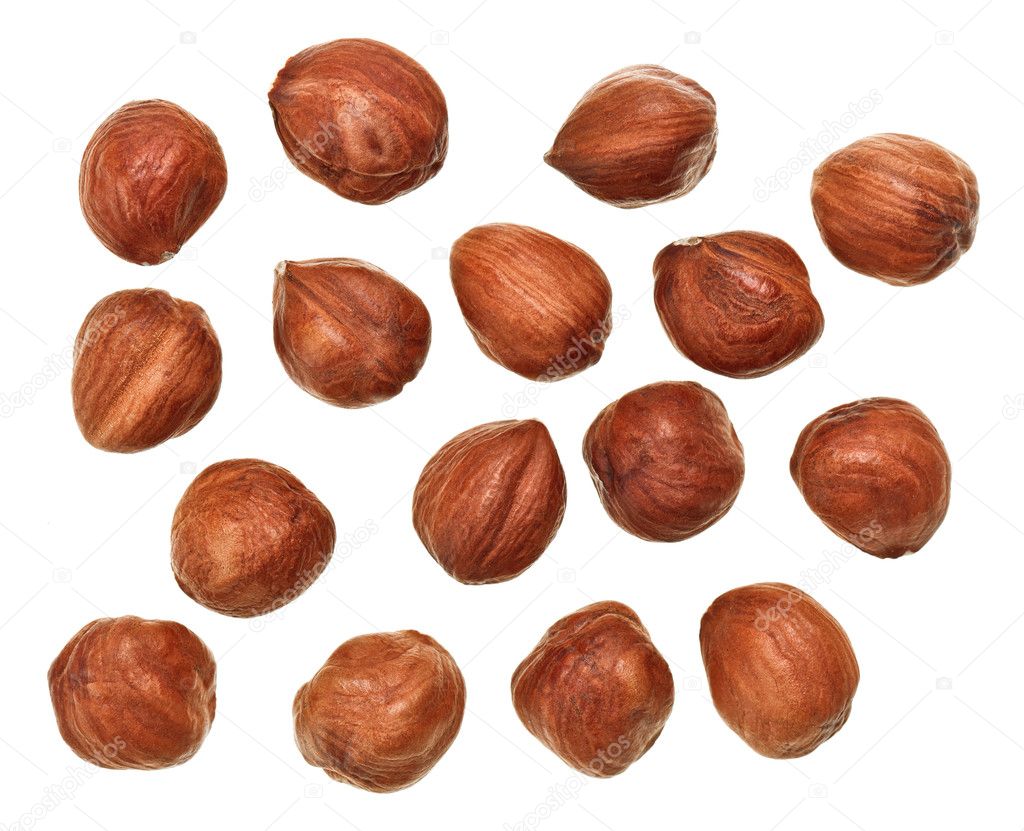 Unshelled hazel nuts isolated on white, food background