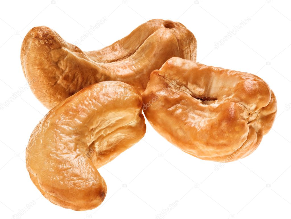 Three unshelled roasted cashew nut, isolated on white