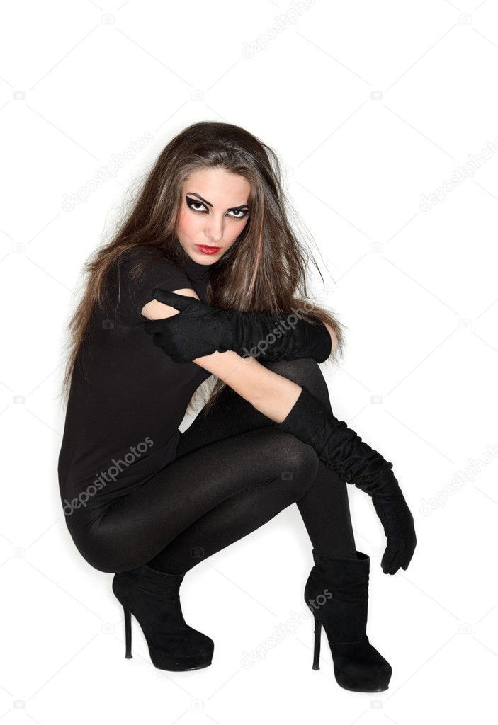 Young beautiful woman in black combi dress and velvet gloves, ri