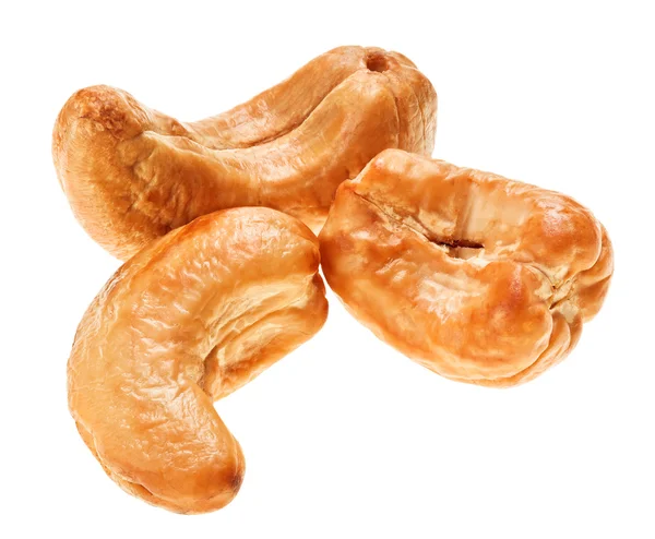 Three unshelled roasted cashew nut, isolated on white — Stock Photo, Image