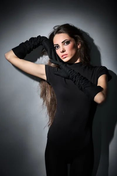 Young slim glamour lady with long hairs dressed in black combi d — Stock Photo, Image