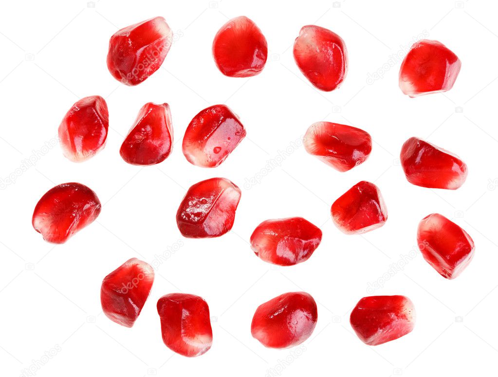 Pomegranate fruit seeds isolated on white macro background