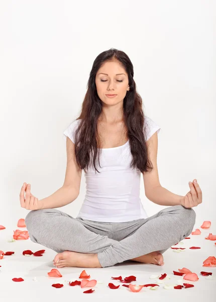 Young beautiful woman meditating in lotus pose — Stock Photo, Image