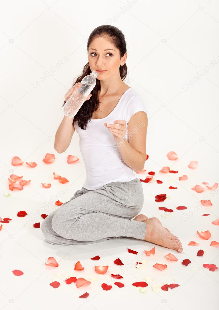 Young beautiful lady drinking gas water