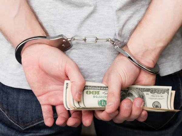 Χειροπέδες Συλλήψεις Νόμισμα Δολάριο Έγκλημα Ανθρώπινο Χέρι — Φωτογραφία Αρχείου
