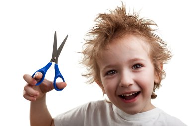 Child holding scissors clipart
