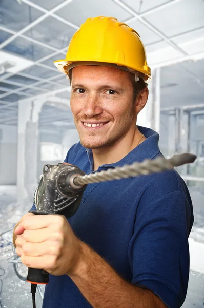 Worker with electric drill — Stock Photo, Image