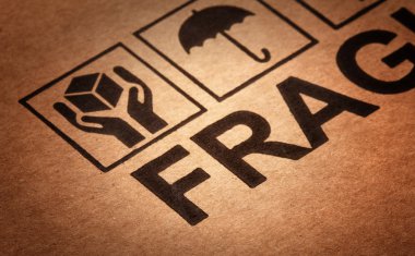 Fine image close up of fragile symbol on cardboard clipart