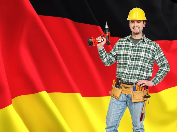 German flag and worker — Stock Photo, Image
