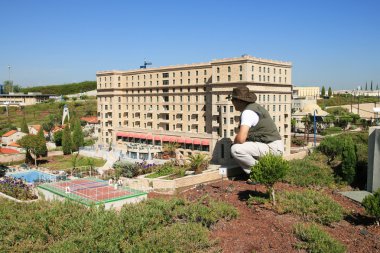 In territory of park Mini-Israel breadboard models of hotels of Israel clipart
