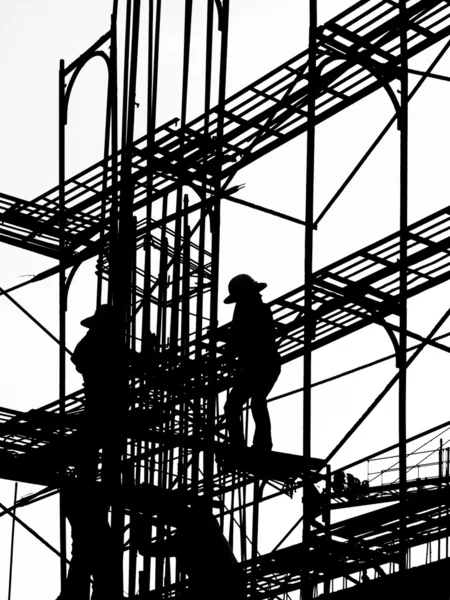Silhouette des travailleurs de la construction — Photo