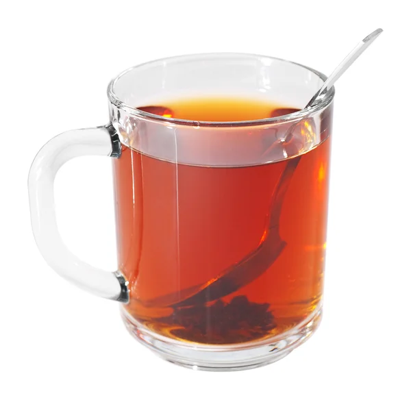 Copo de vidro com chá preto e colher — Fotografia de Stock