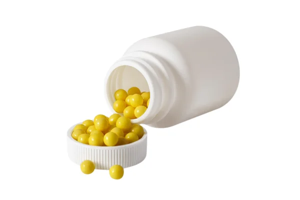 Gele pillen in fles — Stockfoto