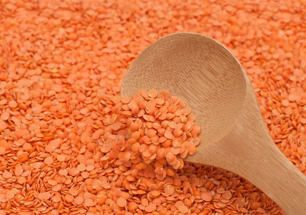 Red Lentils Poured Wooden Spoon — Stock Photo, Image
