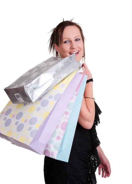 Giovane donna con shopping bags su bianco — Foto Stock