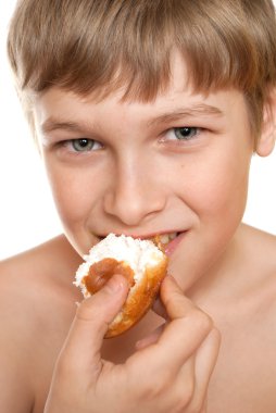 Teen eats cake. The best dessert after a meal. clipart