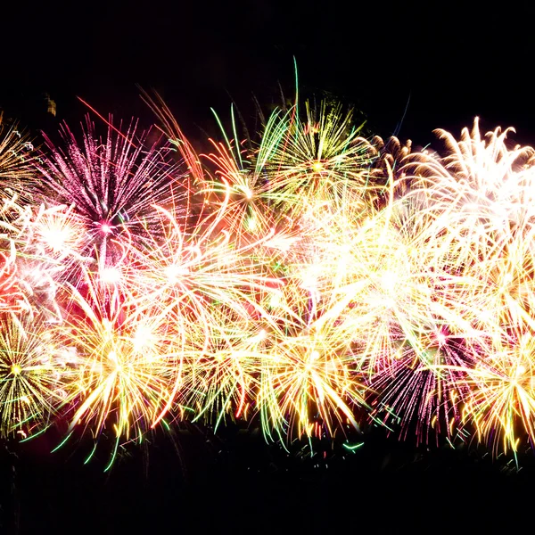 Firework streaks in night sky, celebration background — Stock Photo, Image