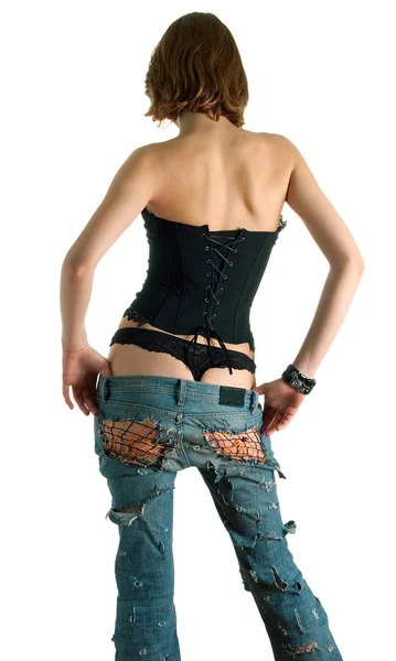 Ragazza in un corsetto nero e jeans blu Fotografia Stock