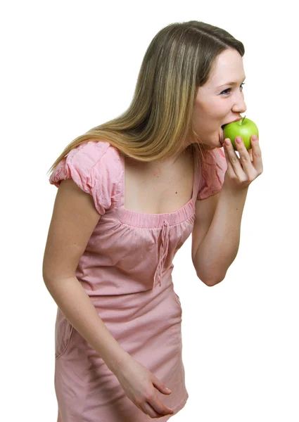Meisje eet een groene appel — Stockfoto