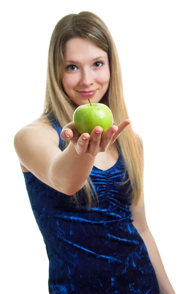 Girl in blue dress with a green apple Royalty Free Stock Photos