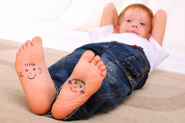 stock image Small faces painted on the soles