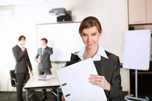 Young business woman in office — Stock Photo, Image