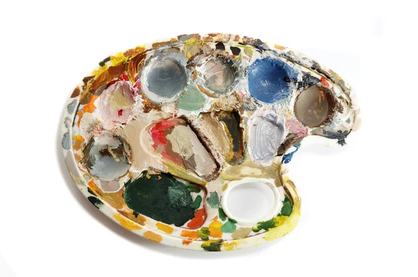 stock image Dirty artist's palette with paints on white background