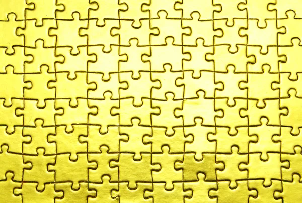 ゴールドのジグソー パズルの背景 — ストック写真